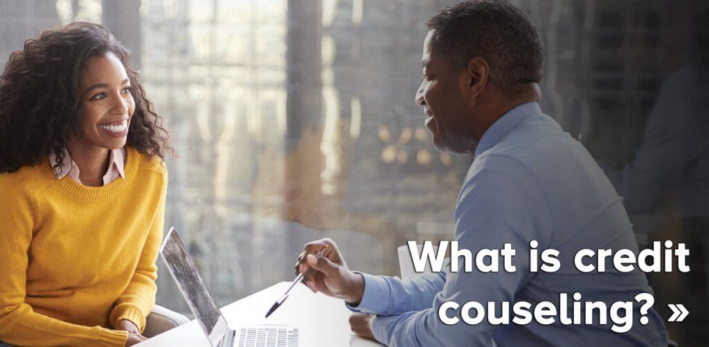 Woman Meeting With Male Financial Advisor image that says what is credit counseling