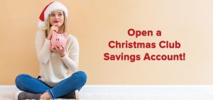 Woman sitting on floor holding piggy bank