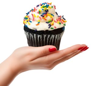 hand holding cupcake