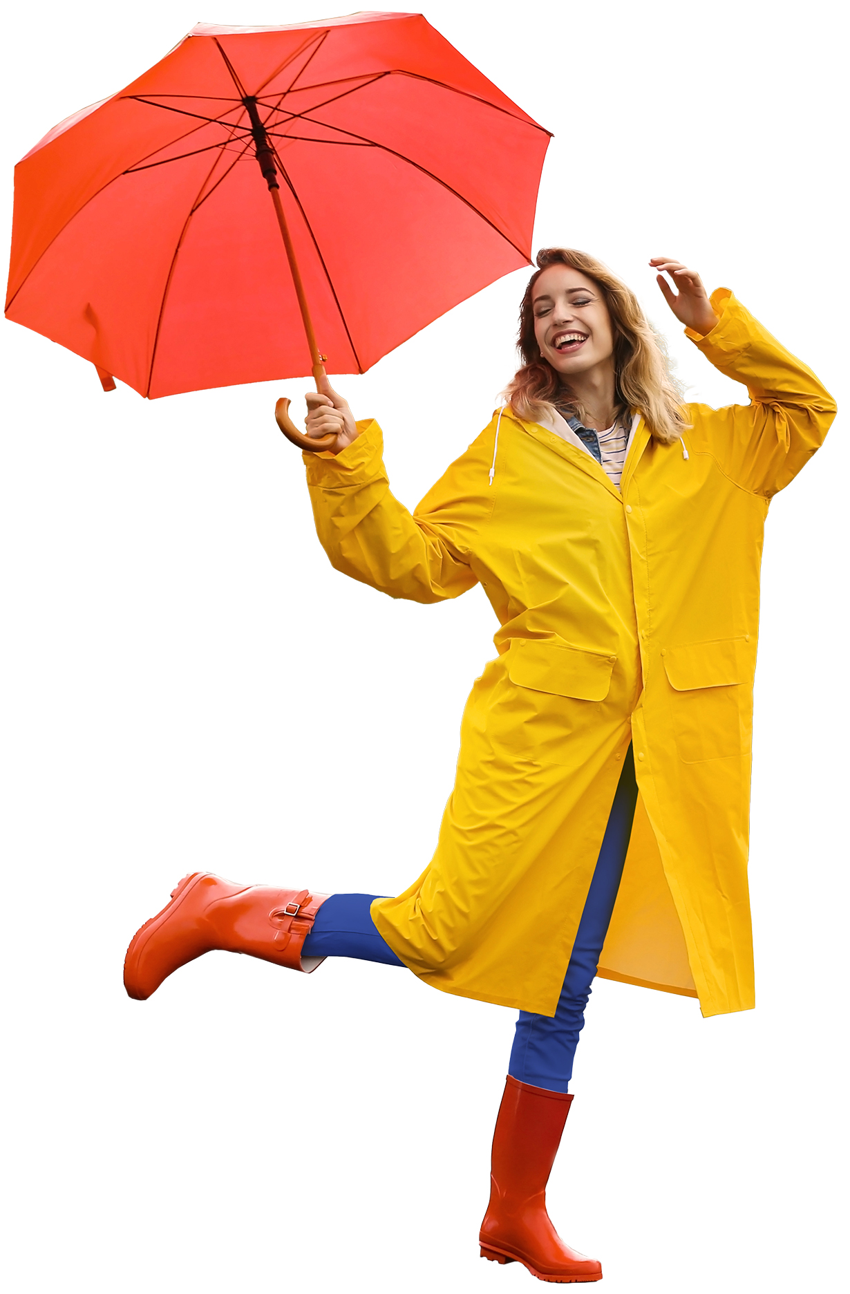 Happy young woman with red umbrella wearing yellow raincoat on street